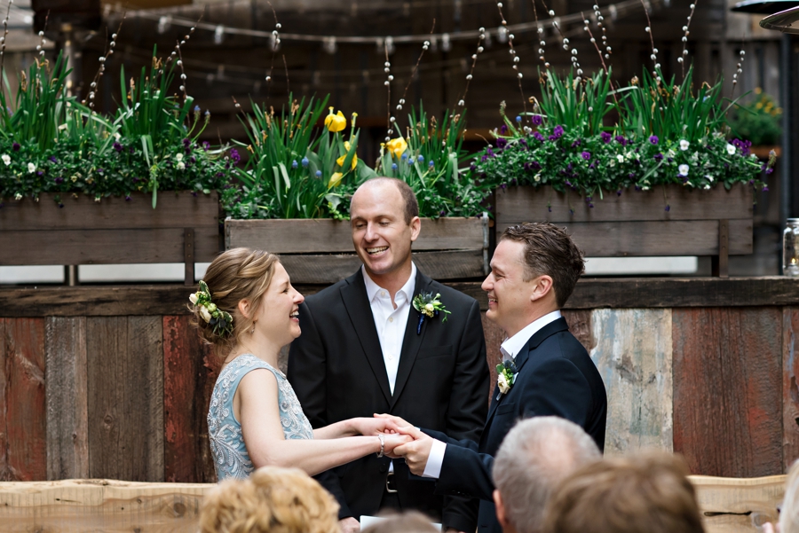 A super excited wedding couple say I do.